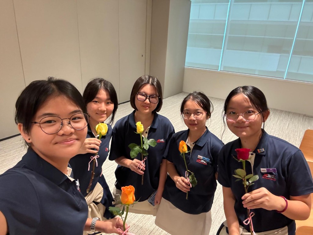 Axelia with fellow students at Celebration of Women in App Developement 2026